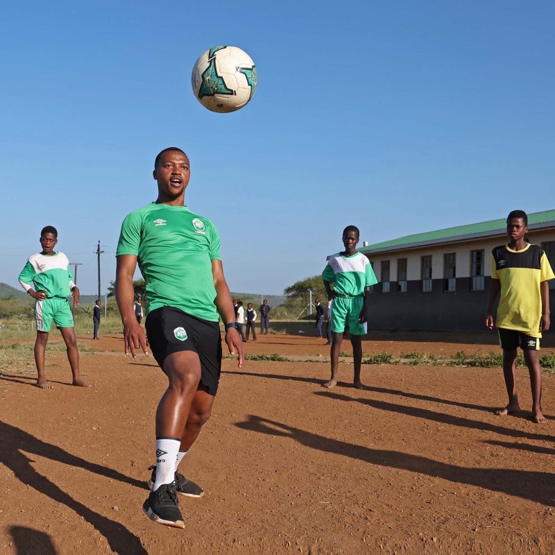 Fisher Foundation borehole activation in the Mthekwini community. Amazulu F.C. had three of their players attend. 400 children will now have access to clean drinking water. AmaZulu defender Thembela Sikhakhane shows off his skills for the youngsters.